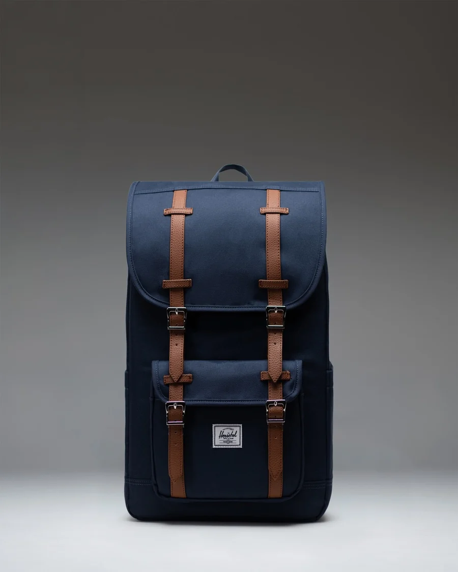Navy Heritage Backpack with brown buckle straps
